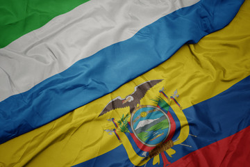 waving colorful flag of ecuador and national flag of sierra leone.