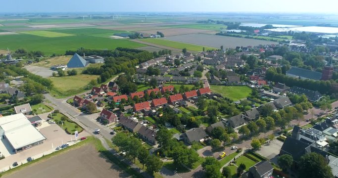 Dutch City Sexbierum, Showing a Neighbourhoord, Both Churches and the Glass Pyramid, Shot Moving Backwards and Right, Friesland, Netherlands / Holland &ndash; 4K Drone Footag