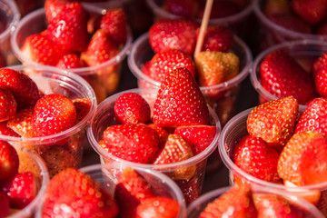 Strawberries in a glass of fruit eating street food in glass, look so fresh and so sweet.
