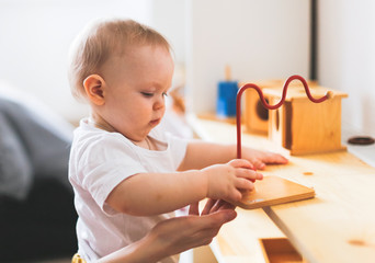 Mom and baby are playing in the Montessori center