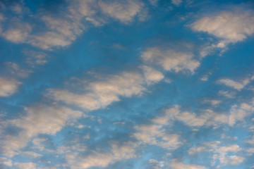 Sunset cloudy sky with the orange sun (Background)