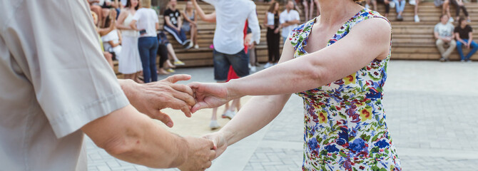 Kizomba, bachata or salsa concept - couple dancing social dance on open air party. - obrazy, fototapety, plakaty