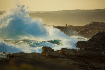 Sunset over stormy seaside