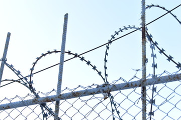 Barbed wire on the fence of a prison or closed area