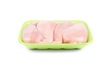 Raw chicken fillet in a green tray ,isolated on white background