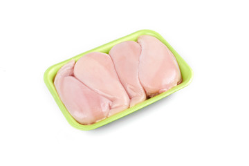 Raw chicken fillet in a green tray ,isolated on white background