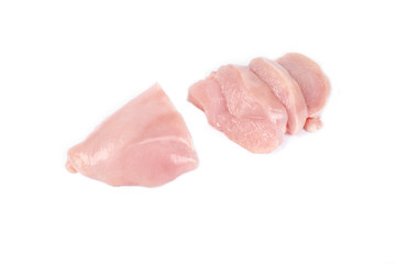 uncooked chicken fillet and slices of chicken fillet isolated on white.