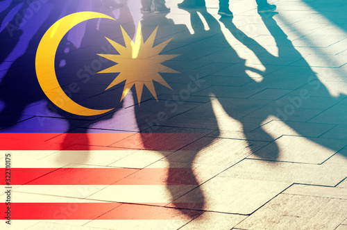 Malaysian Flag and Shadows of People, concept Picture