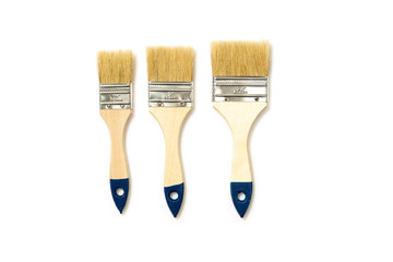 Three wide brushes of different size isolated on white background