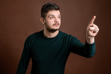Fototapeta premium Young man pressing virtual button