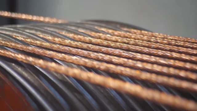 Production of copper cable. Rotating shafts with copper wire.