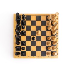 Chess on a wooden board on a white background