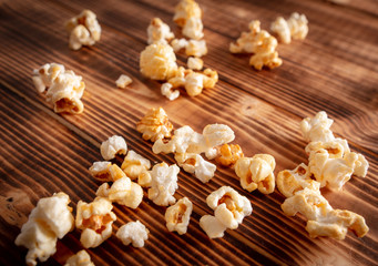 Popcorn flakes on a wooden background