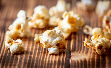 Popcorn flakes on a wooden background