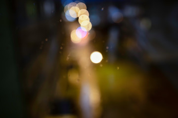 Light zigzags, streaks of light. Lights of the city behind a window pane.  Bokeh - abstract...