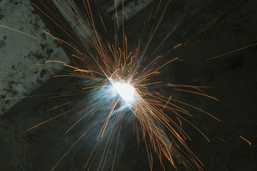 sparks from metal welding at a construction site