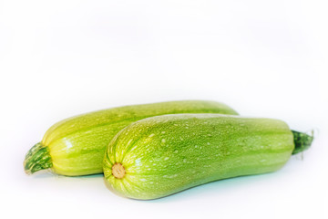 green zucchini on a white background