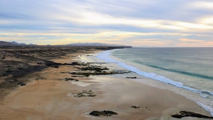 Evening at the El Cotillo beach, Fuerteventura, Spain. Beautiful landscape, just after sunset. Panoramic view