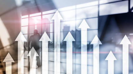 Up arrow graph on skyscraper background. Invesment and financial growth concept.
