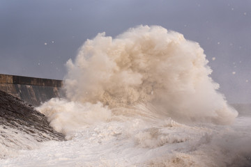Fototapeta na wymiar Storm Ciara reaches the Welsh coast Massive waves as storm Ciara hits the coast of Porthcawl in South Wales, United Kingdom