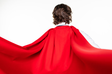 Rear view of businessman in red cout superhero on white background