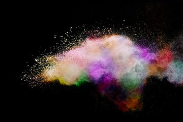 Abstract powder splatted background. Colorful powder explosion on black background. Colored cloud....