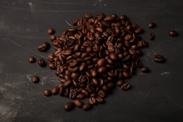Composition with a coffee beans on a textured plastered background with a variety of arbitrary stains