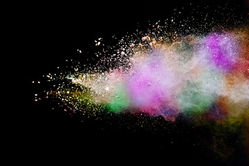 Abstract powder splatted background. Colorful powder explosion on black background. Colored cloud. Colorful dust explode. Paint Holi.