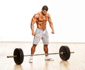 Fototapeta na wymiar Muscular Men, Bodybuilder Preparing To Lift Heavy Weights, Barbell