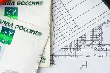 Architectural drawing and Russian Ruble money stack