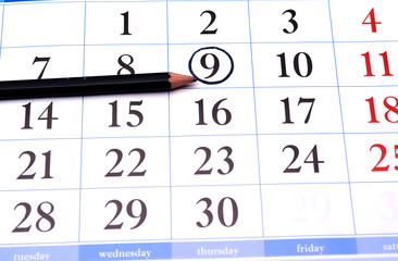 calendar with a black pencil and circle