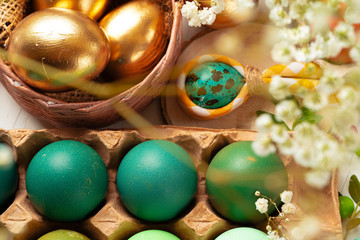 Many Easter eggs decorated with floral branches