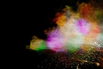 Fototapeta na wymiar Abstract powder splatted background. Colorful powder explosion on black background. Colored cloud. Colorful dust explode. Paint Holi.