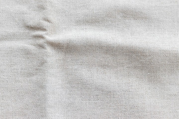 Natural linen fabric texture. Rough crumpled burlap background