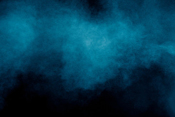 Fototapeta na wymiar Blue color dust particles explosion cloud on black background.Color powder splash.