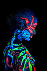 Close up UV portrait of a bodyart flamengo