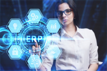 Business, Technology, Internet and network concept. Young businessman working on a virtual screen of the future and sees the inscription: ERP