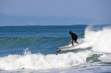 Fototapeta na wymiar Koreans Enjoy Surfing on Feb. 9, 2020 at the Yonghan-ri Beach in Heunghae-eup, Pohansi, South Korea.