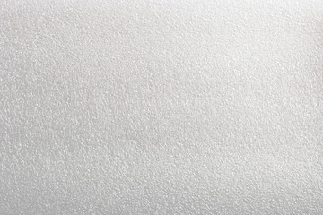 White cellular background made of foamed polyethylene. Packaging material is used in manufacturing...