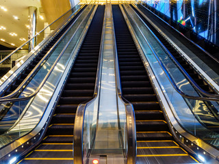 Blurred motion shot of empty escalators at Suntec City Convention and Exhibition Centre in downtown...