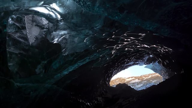 Looking out of large blue glacier ice cave entrance Iceland.mov