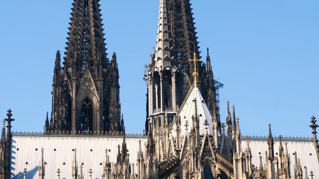 Gothic Cathedral Church of Saint Peter in Cologne, Germany on a sunny day. Beautiful details of the towers, arches and stained glass windows