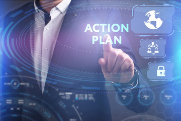 Business, Technology, Internet and network concept. Young businessman working on a virtual screen of the future and sees the inscription: Action plan
