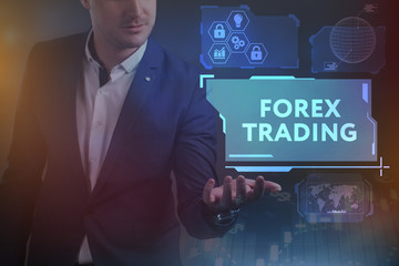 Business, Technology, Internet and network concept. Young businessman working on a virtual screen of the future and sees the inscription: Forex trading