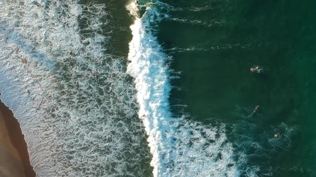 Sea Water and Surfers Aerial View