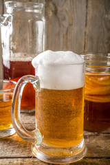 Homemade Kombucha beer, with Kombucha jars on wooden background
