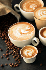 Cups of espresso and a bag of coffee beans