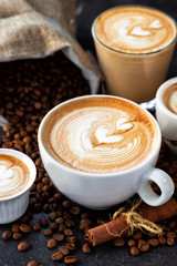 Latte art drawn on various espressos