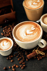 Caffe latte and a bunch of coffee beans