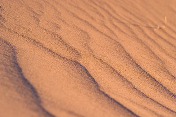 Fototapeta na wymiar Close up background of waves in sand pattern